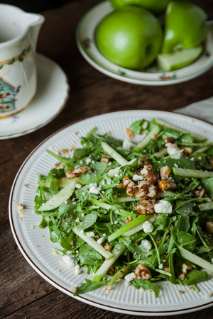 Fresh arugula salad with green apples, walnuts and gogonzola cheeseの写真素材
