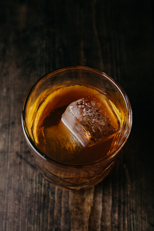 Old Fashioned cocktail on rustic backgroundの写真素材