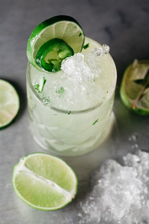 Alcoholic drink with crushed on muted silver backgroundの写真素材