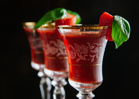 Strawberry and basil cocktails on dark backgroundの写真素材