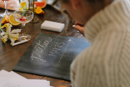 Participants jot ideas on a blackboard, enjoying snacks and drinks in a relaxed atmosphere.