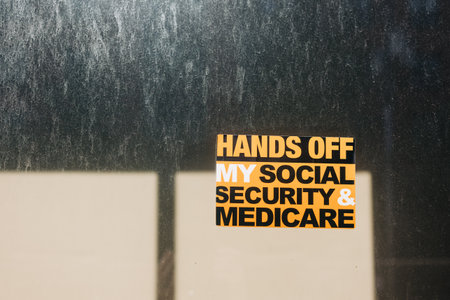 Message displayed on a window urging protection of social security and Medicare rightsの写真素材