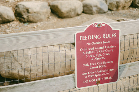 Feeding rules detail what food can be given to goats, pigs, cows, and other animals at a petting...