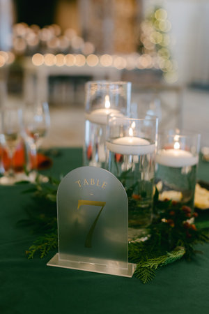 A stunning table arrangement featuring candles and greenery, perfect for an elegant festive gathering or celebration.の写真素材