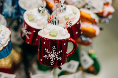 Colorful red mugs with whipped cream and candy canes create a cheerful holiday atmosphere in a shop.