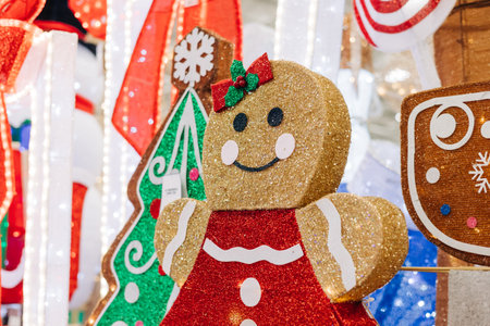 A cheerful gingerbread figure stands among bright holiday decorations, adding joy to the winter...