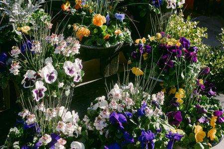 Bright flower arrangements in various colors fill the market, creating a lively and vibrant scene.