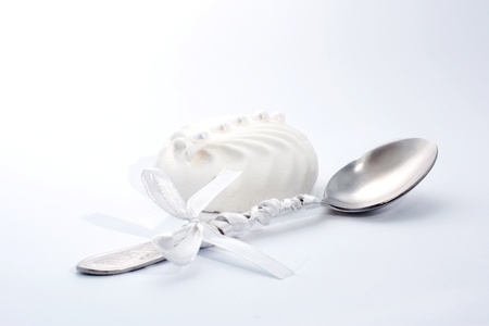 sweet desert  from white milky zephyr lie on a table near festive spoon の写真素材