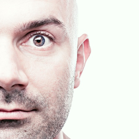 Close-up mature man with glowing eyes contemplating great idea coming to his mind. Surprised face is isolated object on white background.の写真素材