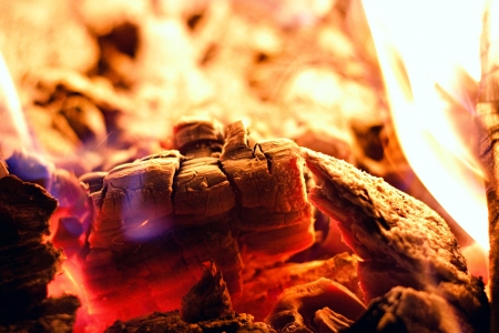 Macro of hot embers at the begining of a fire 
