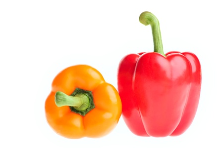 Fresh orange and red Bell Peppers isolated on white の写真素材