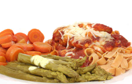 Baked Chicken with Marinara Sacuce, Cheese and  Wheat Pasta with Carrots and Asparagusの写真素材