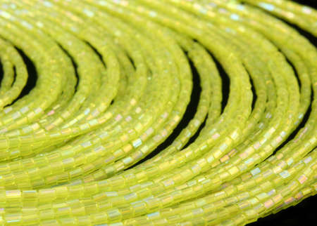 Green Beaded Necklace on Black Background, Close-up
