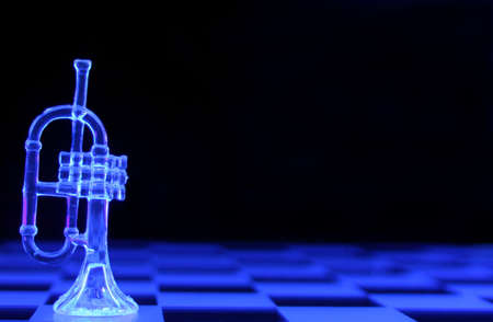 Glass Trumpet under Blacklight. Shallow DOF, Focus on Bottom of Trumpetの写真素材