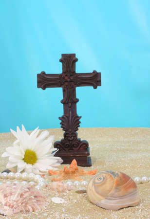 Sea Shells With Cross on Sand, Shallow DOF Focus on Shellsの写真素材