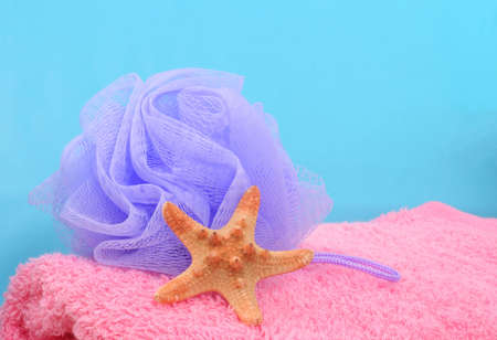 Sponge, Towel and starfish on Blue Background