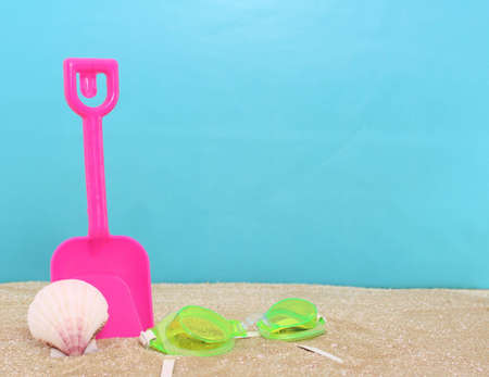 Beach Toys on Sand With Blue Backgroundの写真素材