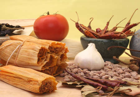 Tamales with Peppers and Beans on Yellow Backgroundの写真素材