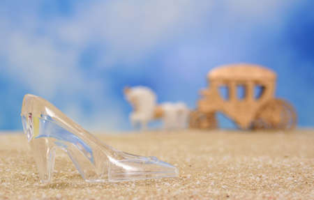 Glass Slipper on Beach With Carriage in Background, Shallow DOFの写真素材