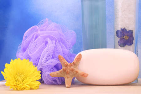 Bath Salts and Soap With Flower on Blue Textured Backgroundの写真素材