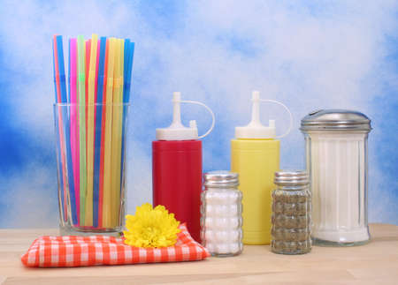 Ketchup, Mustard and Sugar on Blue Textured Backgroundの写真素材