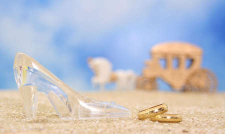 Glass Slipper with  Rings on Beachの写真素材