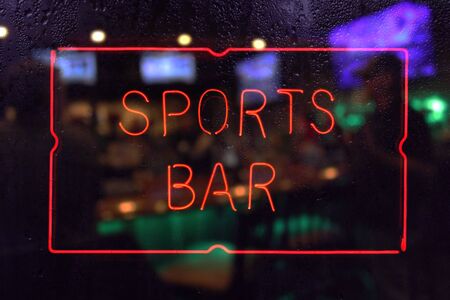 Neon Sports Bar Sign, Rainy Window Blur Imageの写真素材