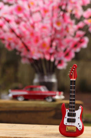 Guitar with Vintage Car and Cherry Blossoms, Shallow DOF の写真素材