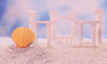 Seashell on Tropical Beach With Roman Style Ruins