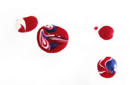 Red, White and Blue Nail Polish Spilled on White