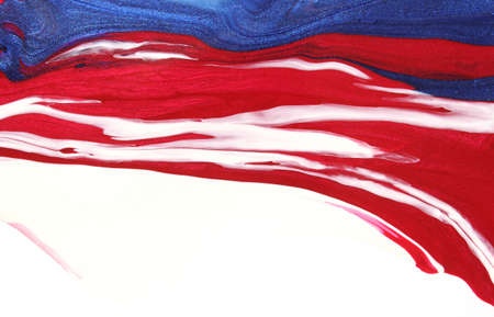 Red, White and Blue Nail Polish Spilled on White Backgroundの写真素材