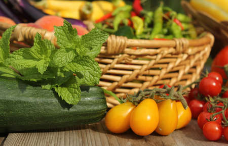 Organic Summer Vegetable Harvest on Table Outdoorsの写真素材
