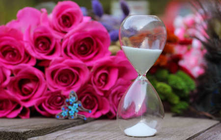 Vintage Hourglass With Pink Roses and Peacock Feathers
