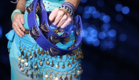 Belly Dancer Close-up With Tambourine and Blue Costumeの写真素材