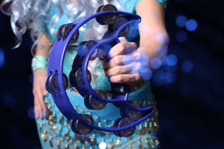 Belly Dancer Close-up With Tambourine and Blue Costumeの写真素材