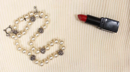Pearls and Red Lipstick on White Sweater Closeupの写真素材