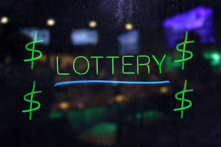 Neon Lottery Sign in Rainy Windowの写真素材