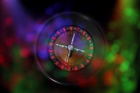 Casino Games With Colorful Bokeh PArty Lights Roulette wheelの写真素材