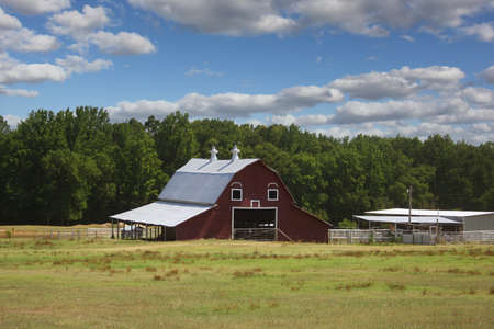 Red Barn located on Farm in East Texas with Blue Skyの写真素材