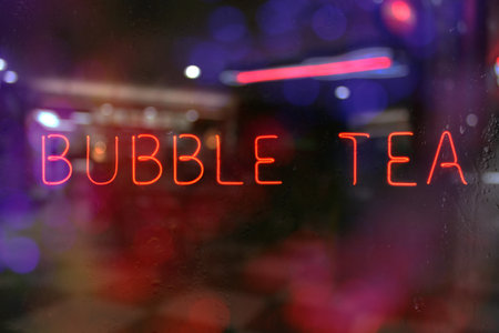 Vintage Neon Bubble Tea Sign in Window of Restaurantの写真素材