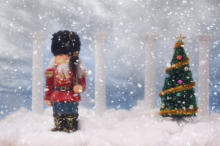 Nutcracker With Christmas Tree and Snow Falling