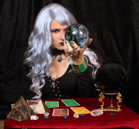 Psychic with blue hair, crystal ball and tarot cards Psychic Witch