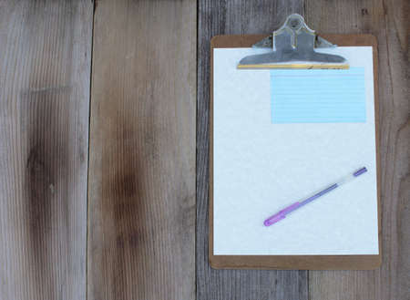 Clipboard With Blank Sheet of Paper on Wooden Table Flat Background Image