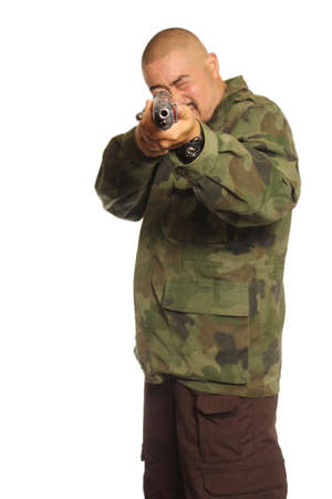Man Wearing Camouflage Holding a Gun Isolated on Whiteの写真素材