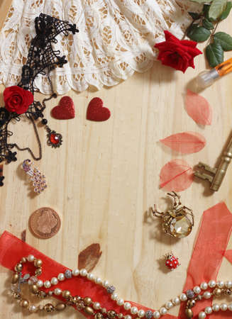 Vintage Jewelry and Lace With Antique Coin on Wood Backgroundの写真素材