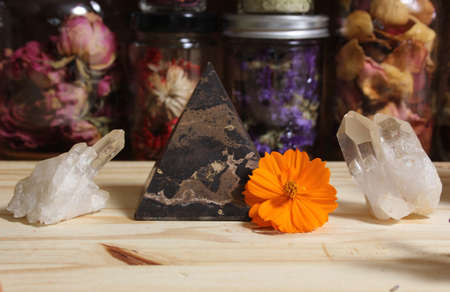 Quartz Crystals and Stone Pyramid With Flower. Relaxation and Meditation Decorの写真素材