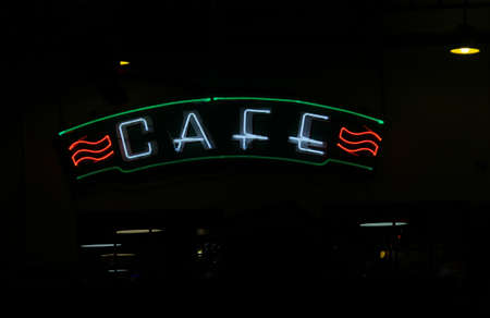 Vintage Style Neon Cafe Sign on Small Town Restaurant
