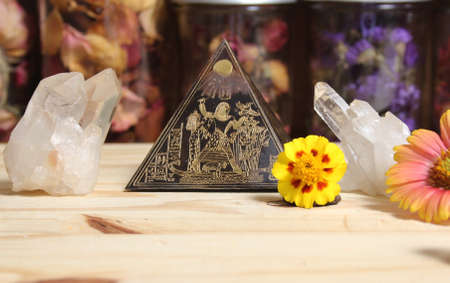 Quartz Crystals and Stone Pyramid With Flower. Relaxation and Meditation Altar