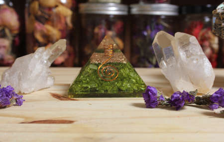 Quartz Crystals and Stone Pyramid With Flower. Relaxation and Meditation Altarの写真素材