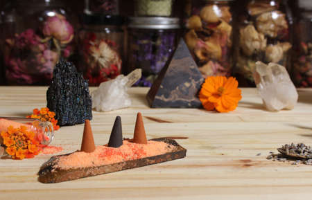 Aragonite Crystal With Incense and Stone Pyramid on Meditation Tableの写真素材